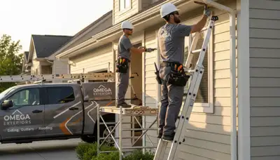 Technician repairing home gutters and vinyl siding in Jacksonville, FL for Next Level Exteriors