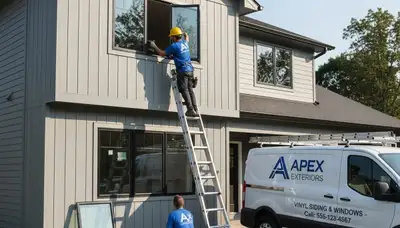 Technician repairing storm-damaged window frame at Jacksonville FL home by Next Level Exteriors